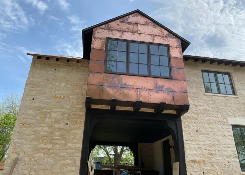 Copper metal panel facade on a stone building for Metal Roof Coating in Briarcliff Manor